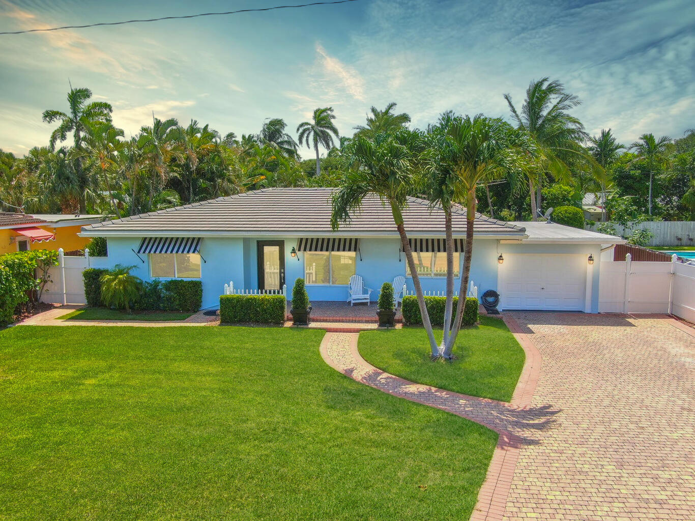 a front view of a house with garden