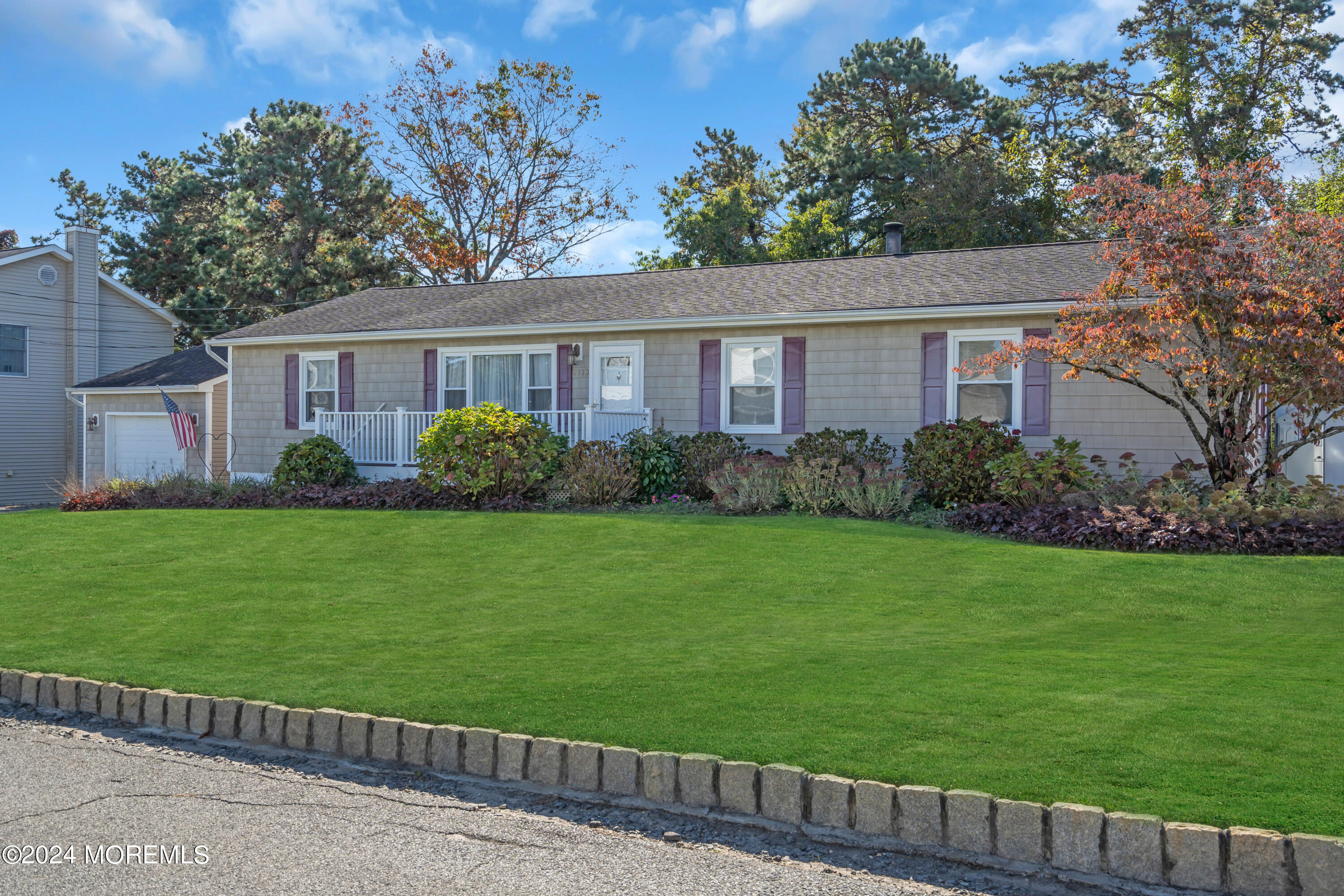 a front view of a house with garden