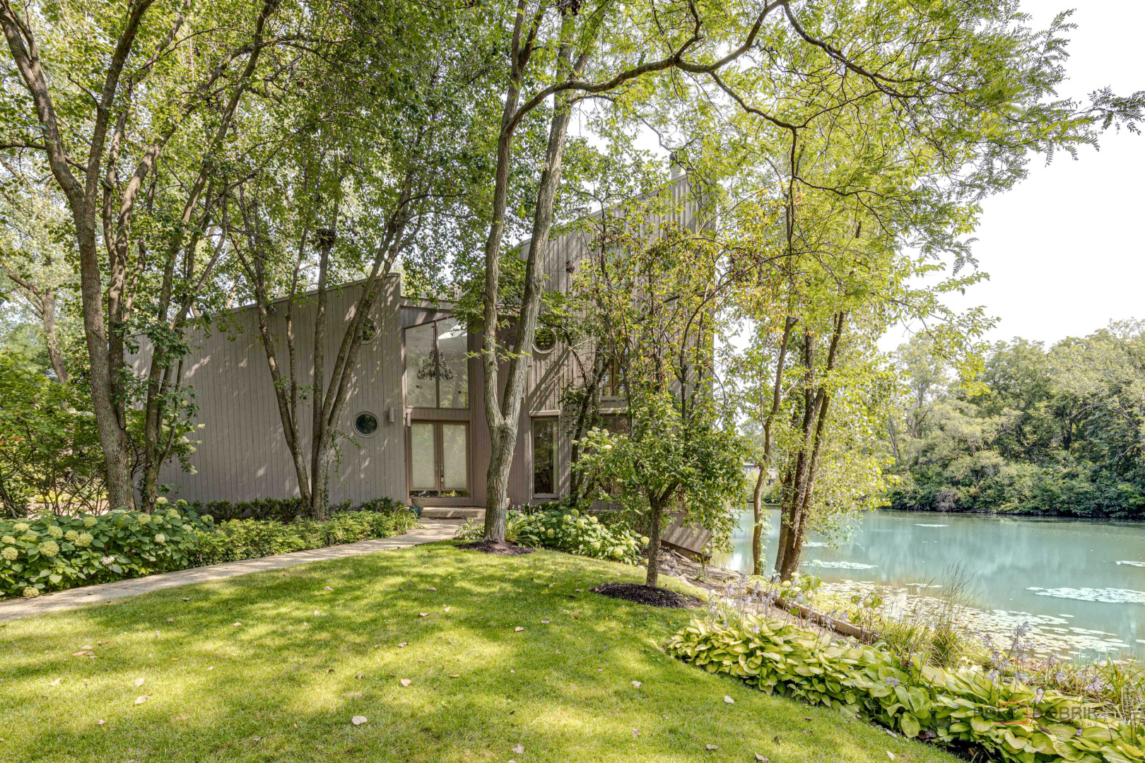 a view of a yard with large trees