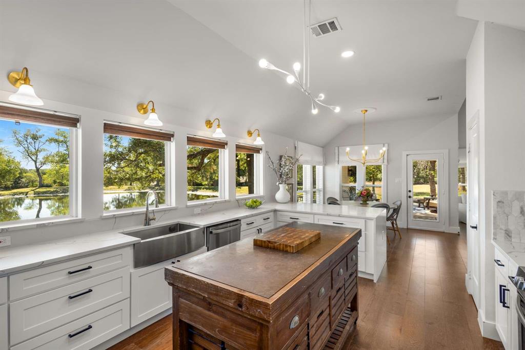 a kitchen with a stove a sink and a refrigerator