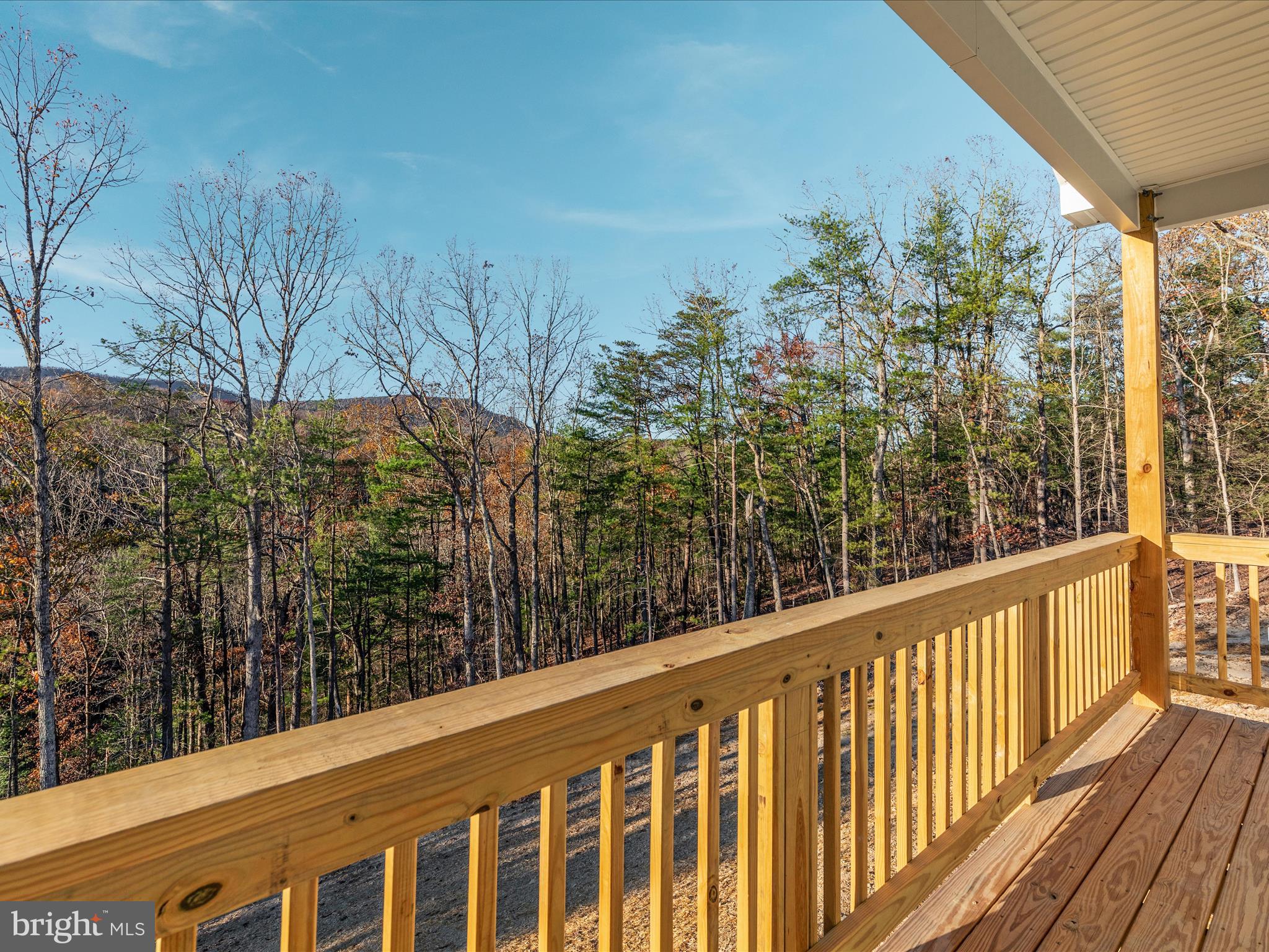 a view of a balcony with wooden fence