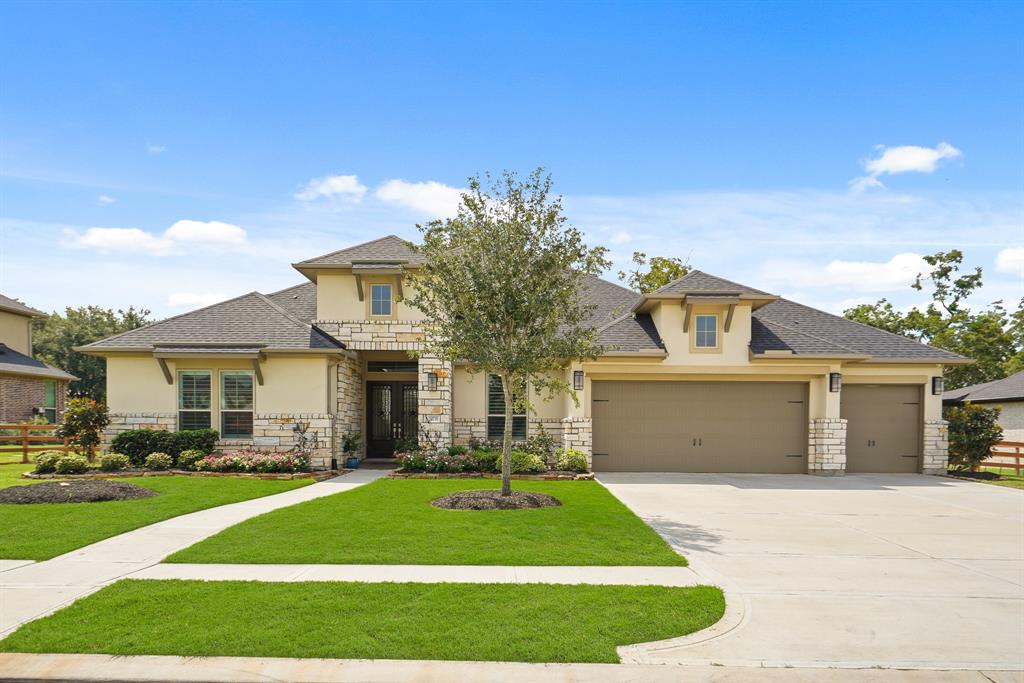 This traditional, yet Mediterranean influenced, single-story home boasts 4 Bedrooms, 3.5 Bathrooms, and an abundance of fine finishes. The stacked stone exterior accent, combined with elaborate window awnings, and colorful landscaping adds to the home’s stellar curb appeal.