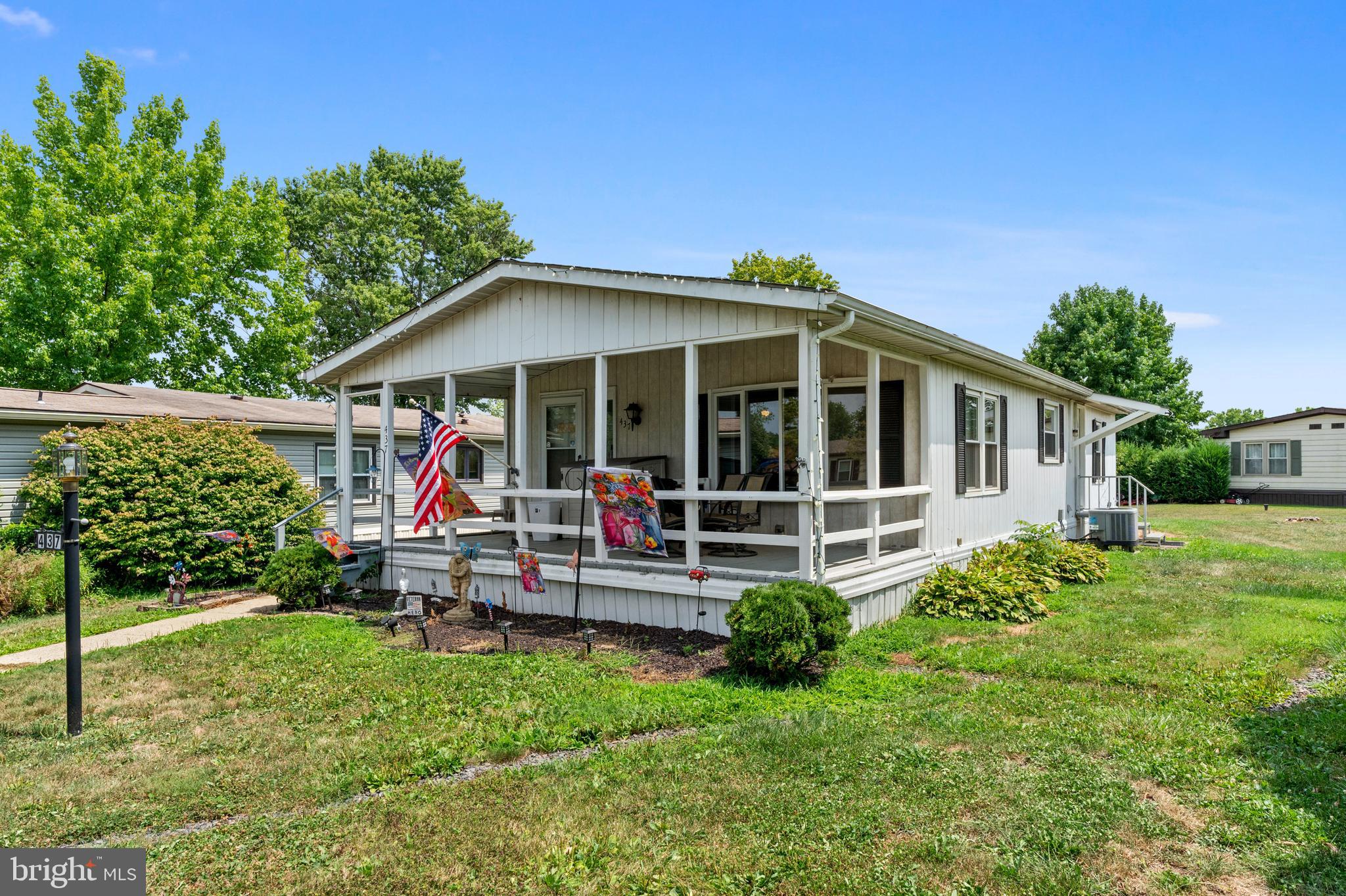 a view of a house with a backyard balcony and sitting area