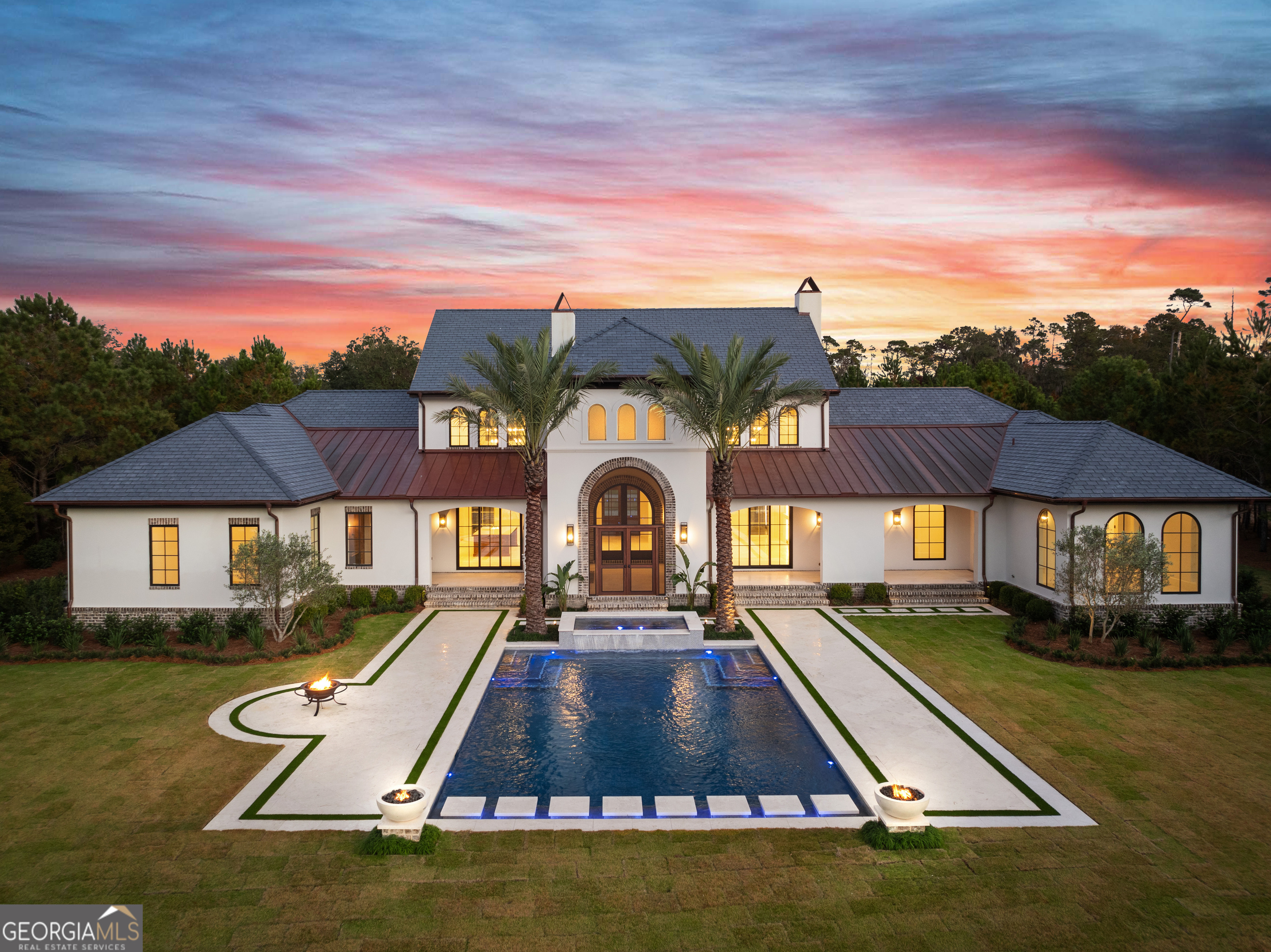 a view of swimming pool with lawn chairs and a yard