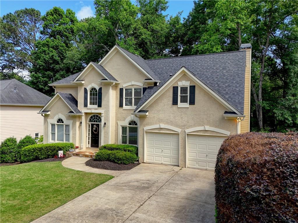 a front view of a house with a yard