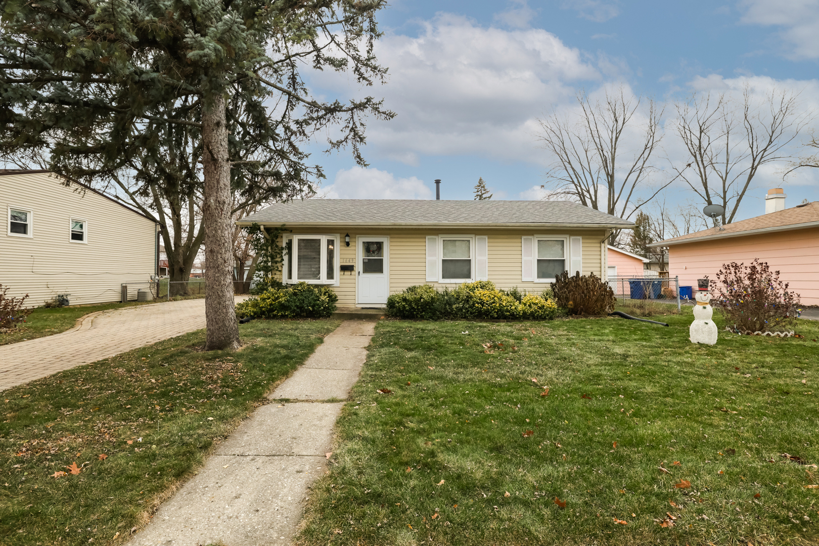 a front view of a house with garden