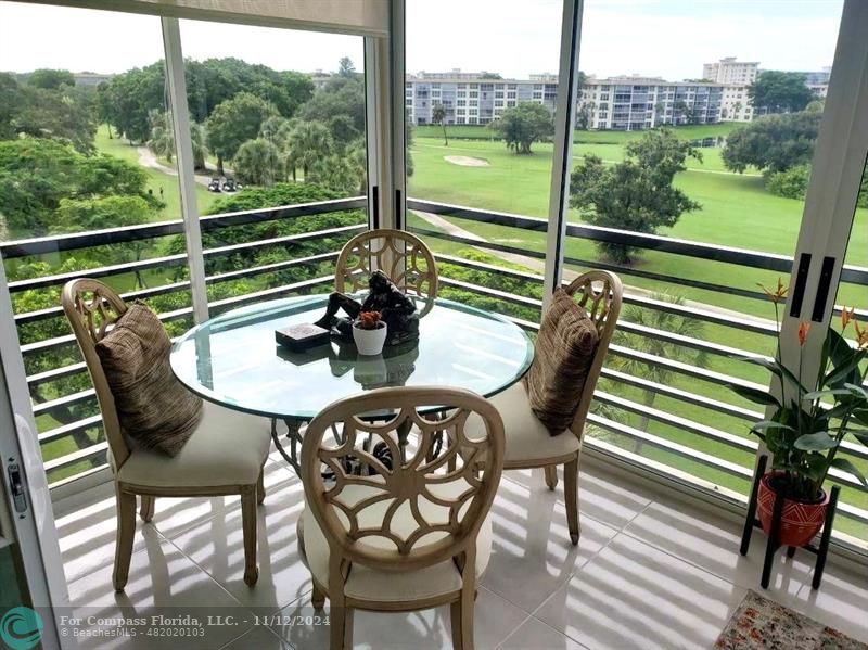 a view of a chairs and table on the deck