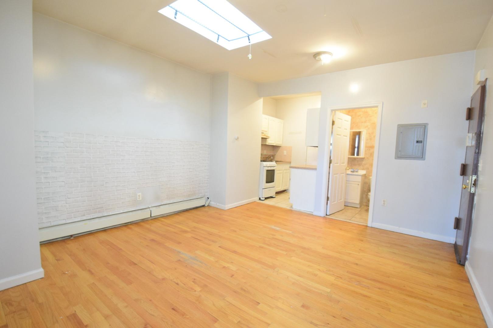 a view of a bedroom with a furniture