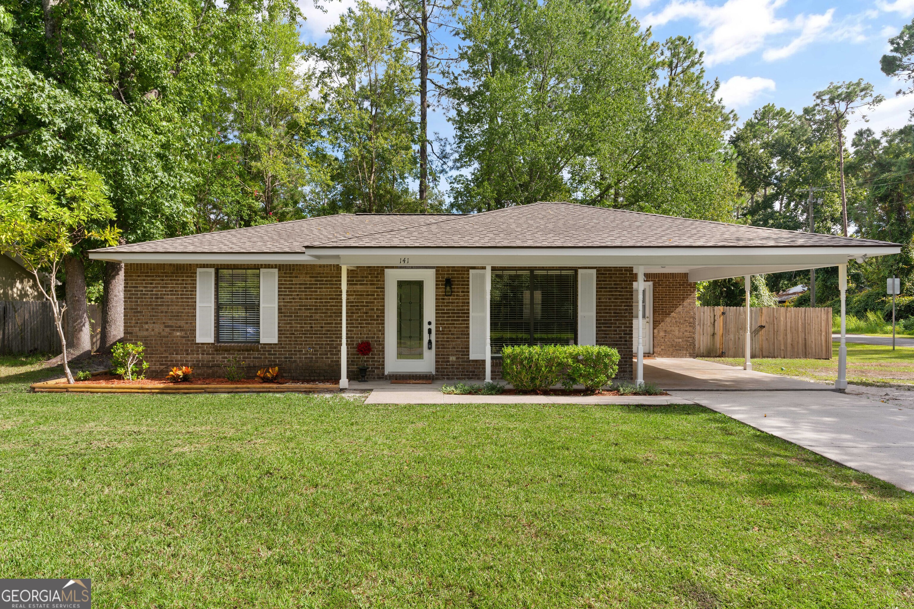 a front view of a house with a yard and porch