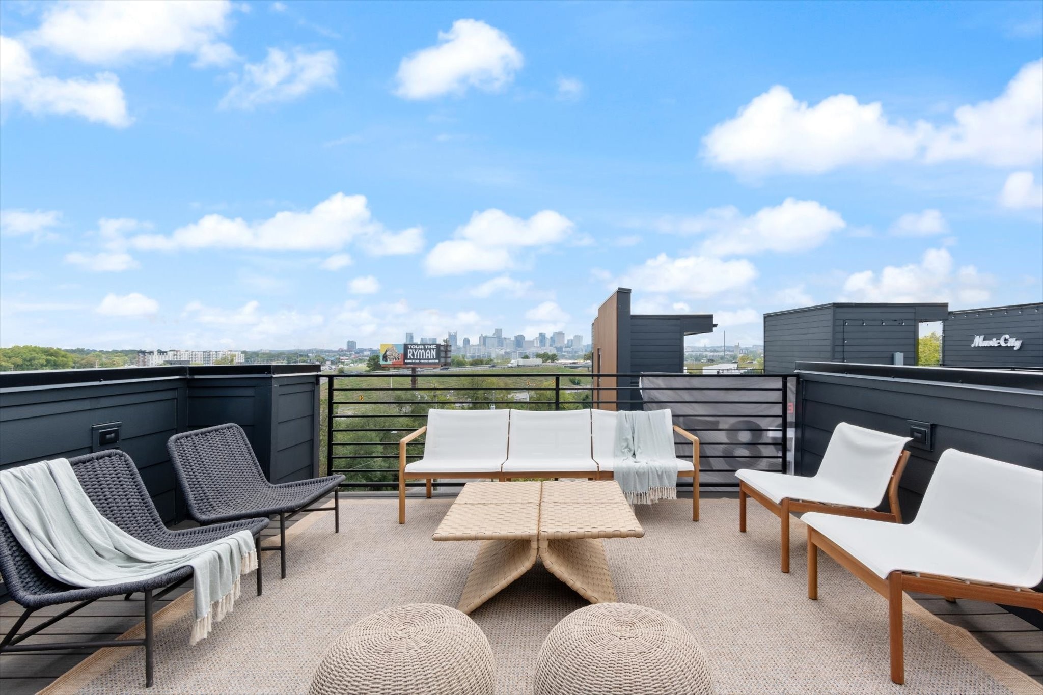 a balcony with furniture and city view