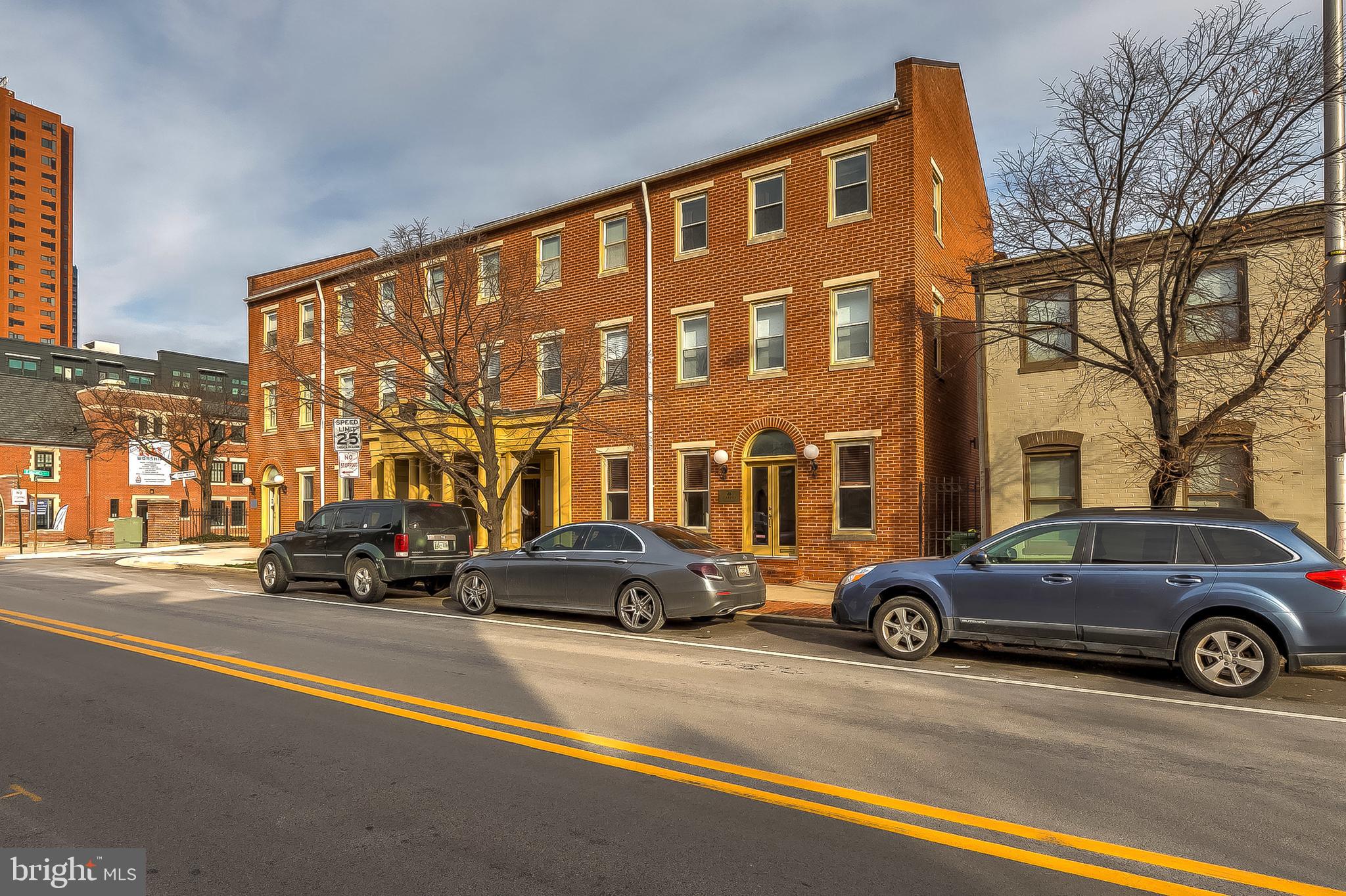 a view of a cars parked in front of a building