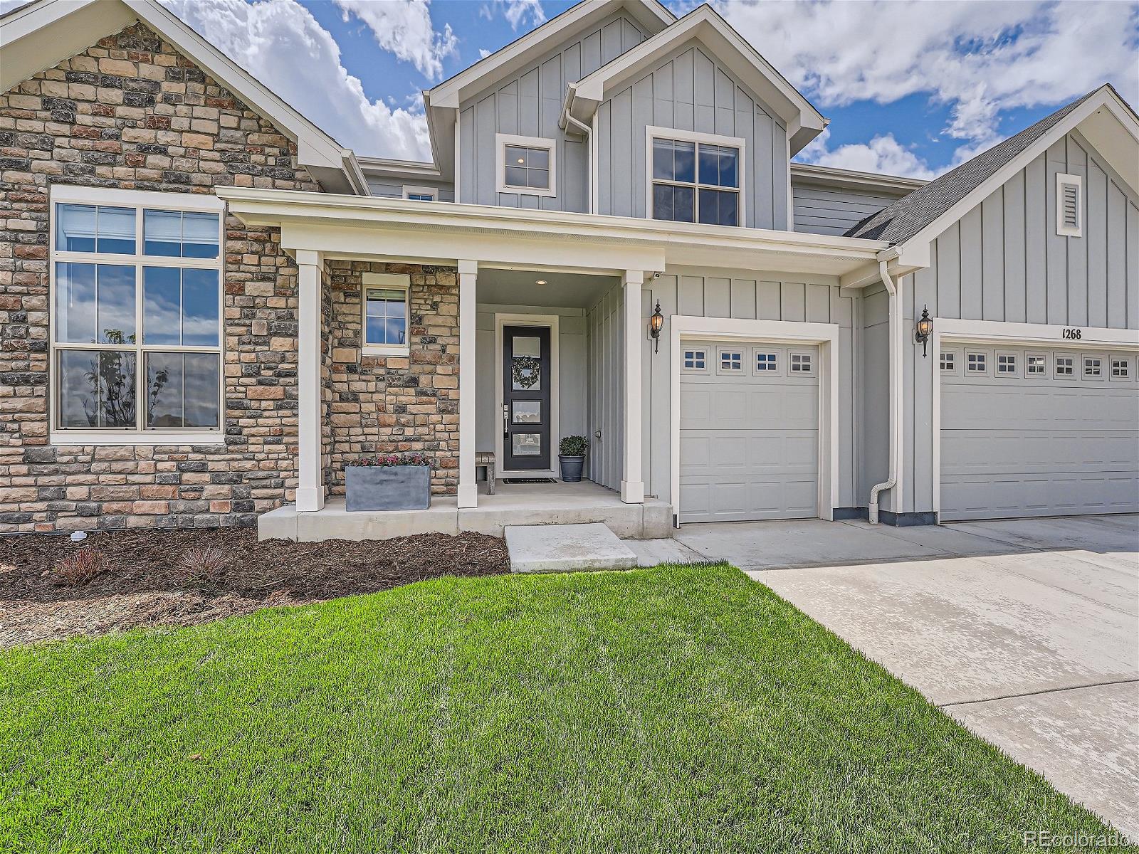 front view of a house with a yard