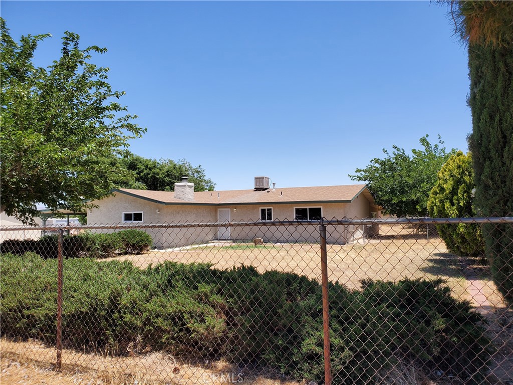 a house view with a backyard space