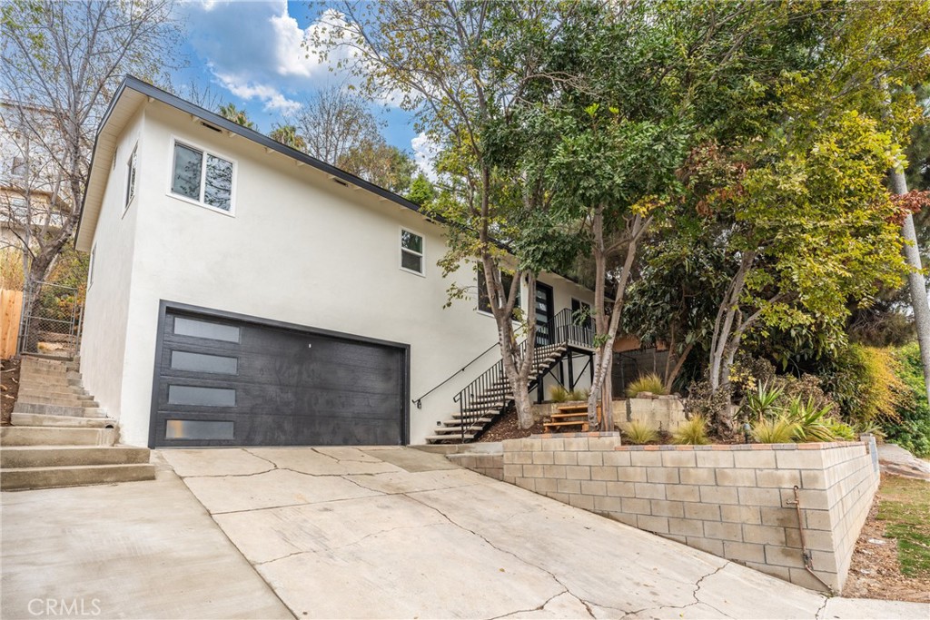 a front view of a house with garage