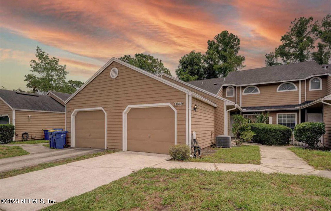 a view of a yard in front view of a house