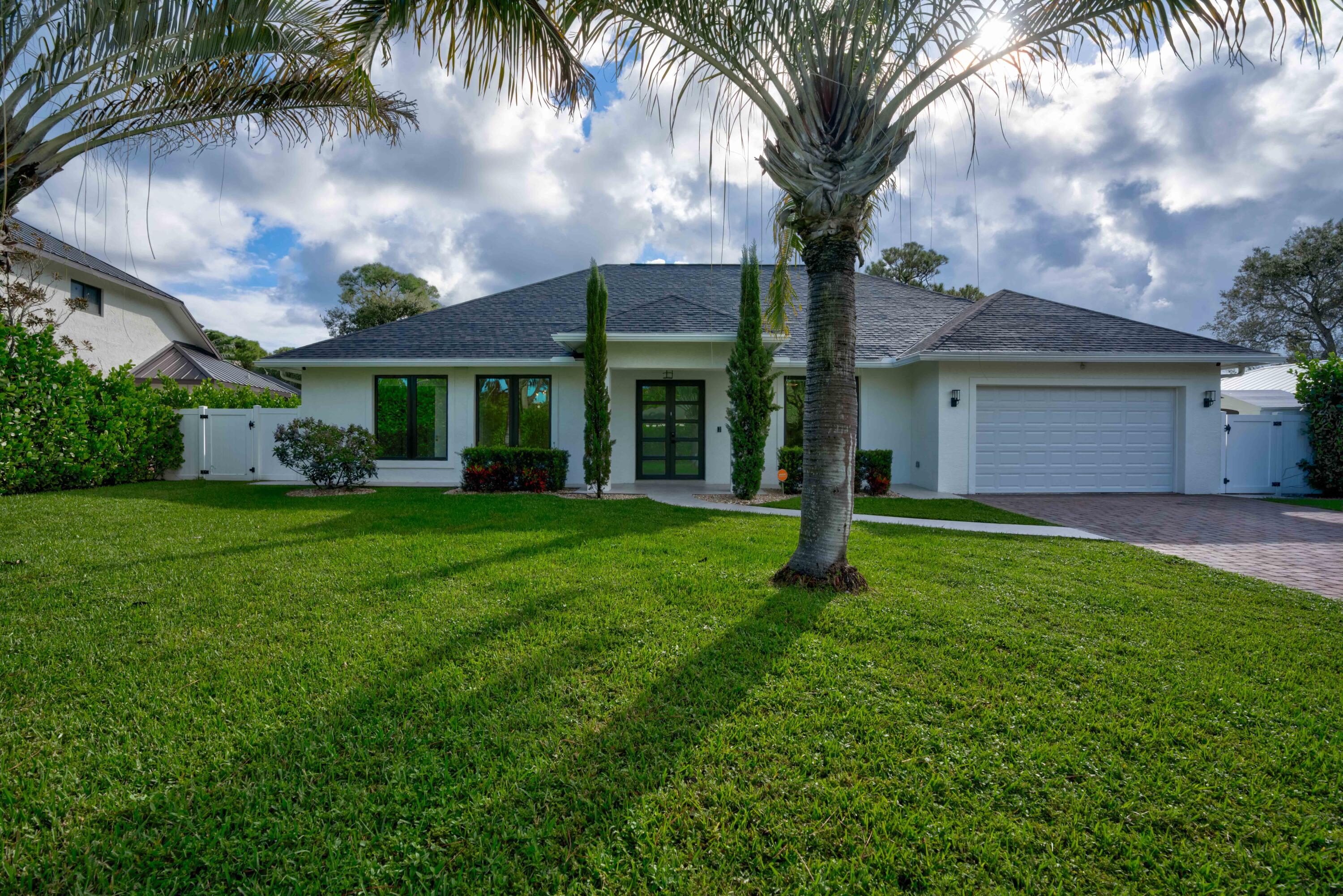 a front view of house with yard and green space