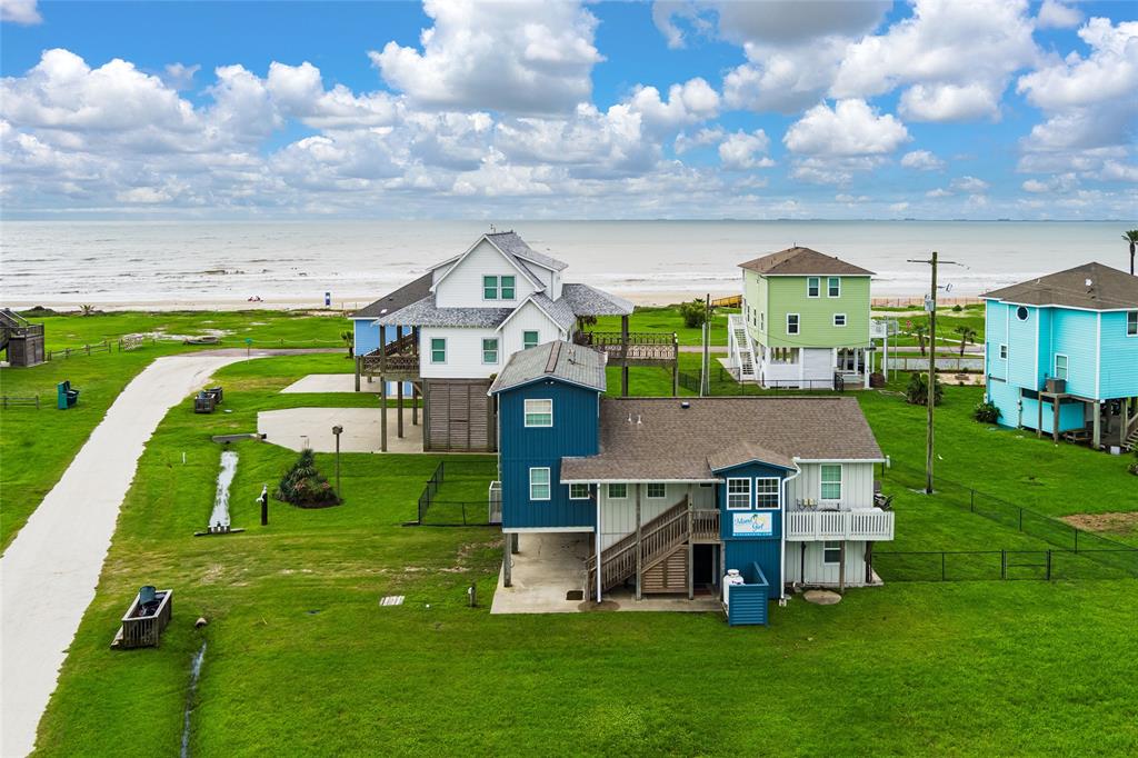 an aerial view of a house with a big yard