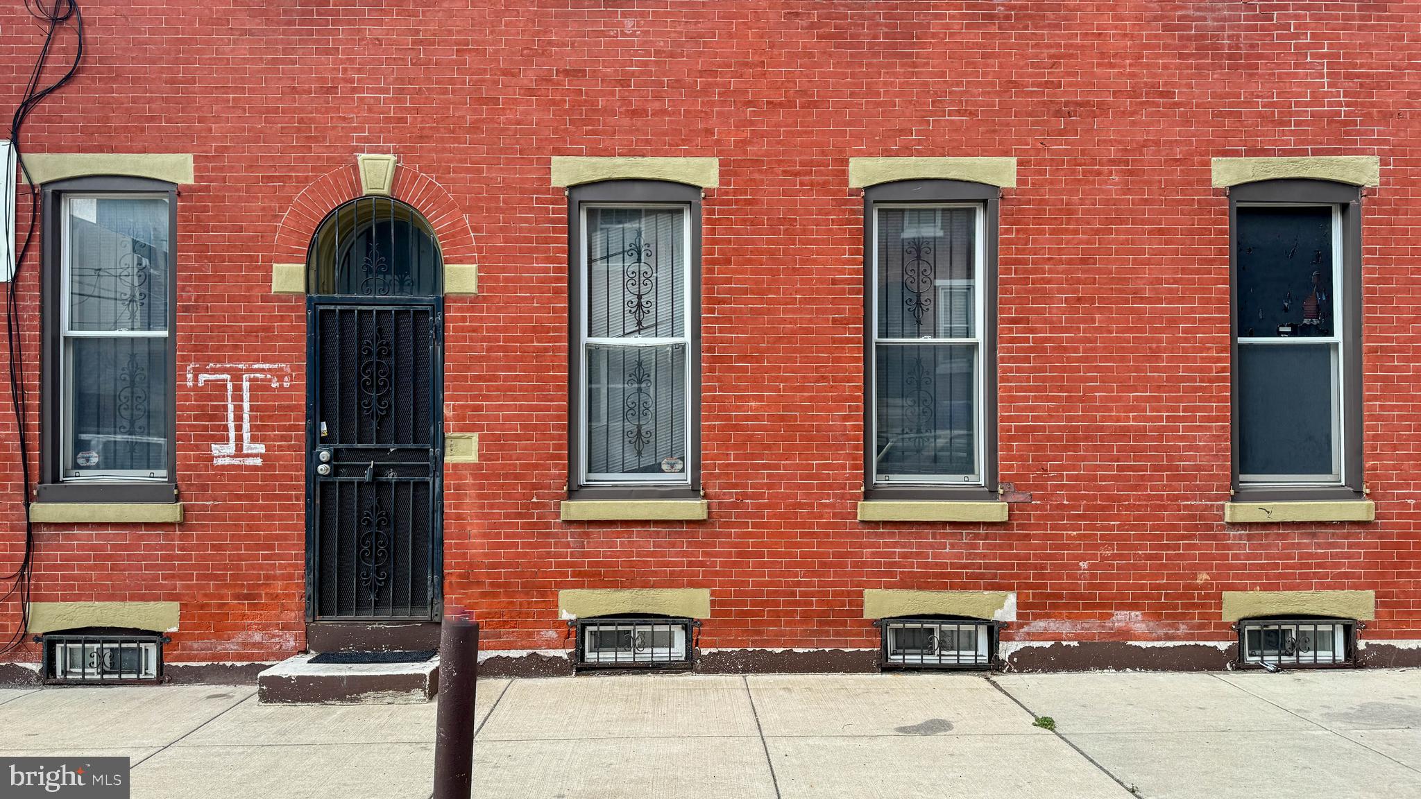 a front view of a house with many windows