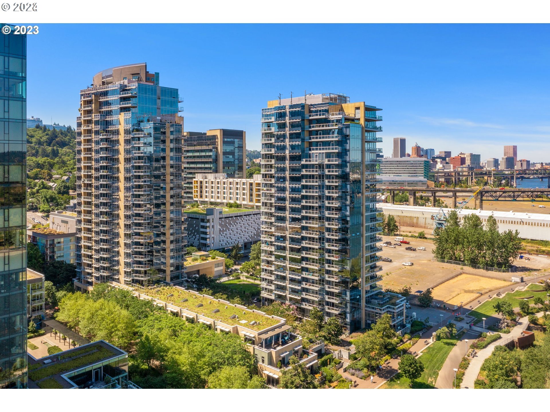 a view of city with tall buildings