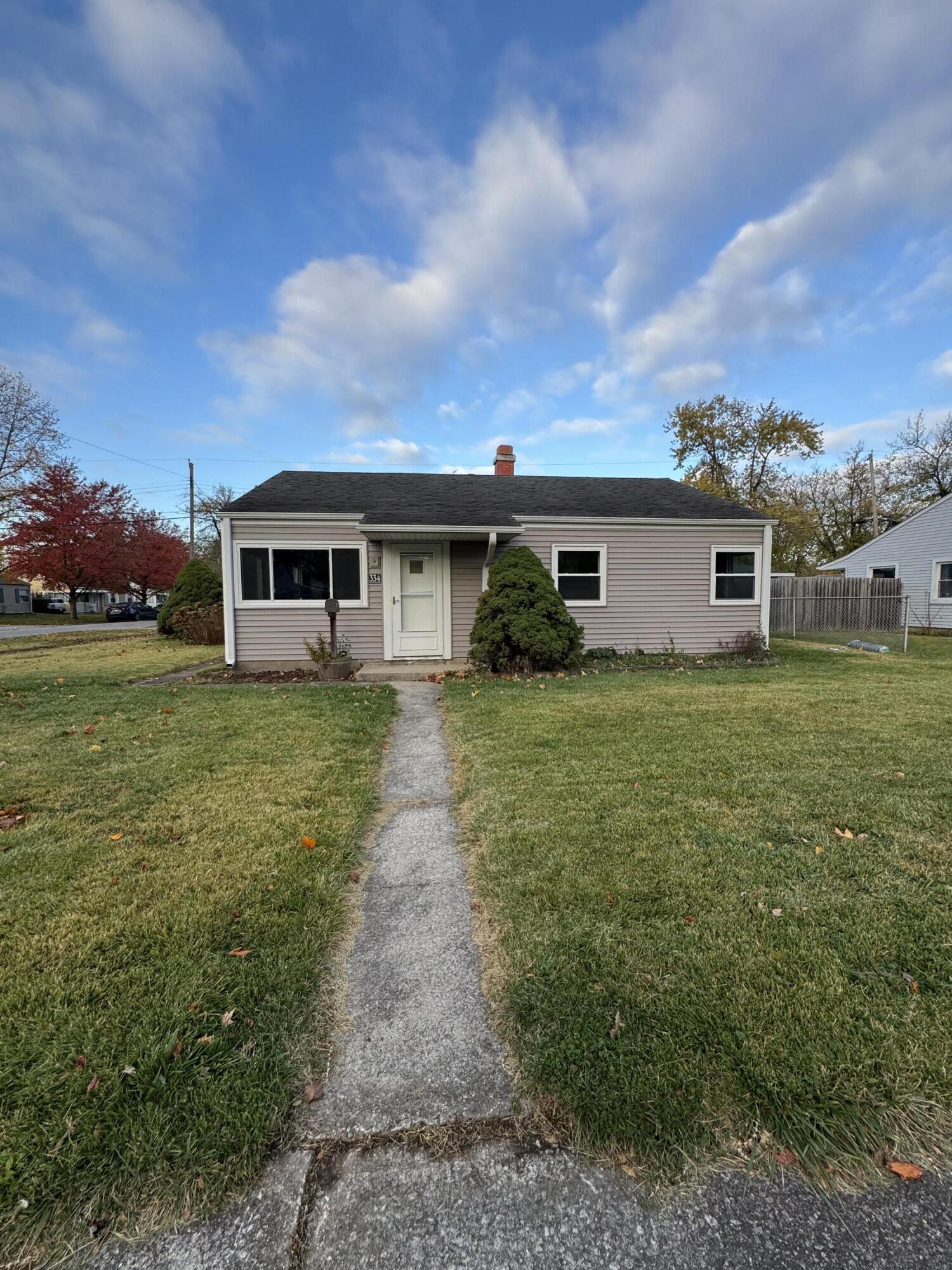 a view of a house with a yard