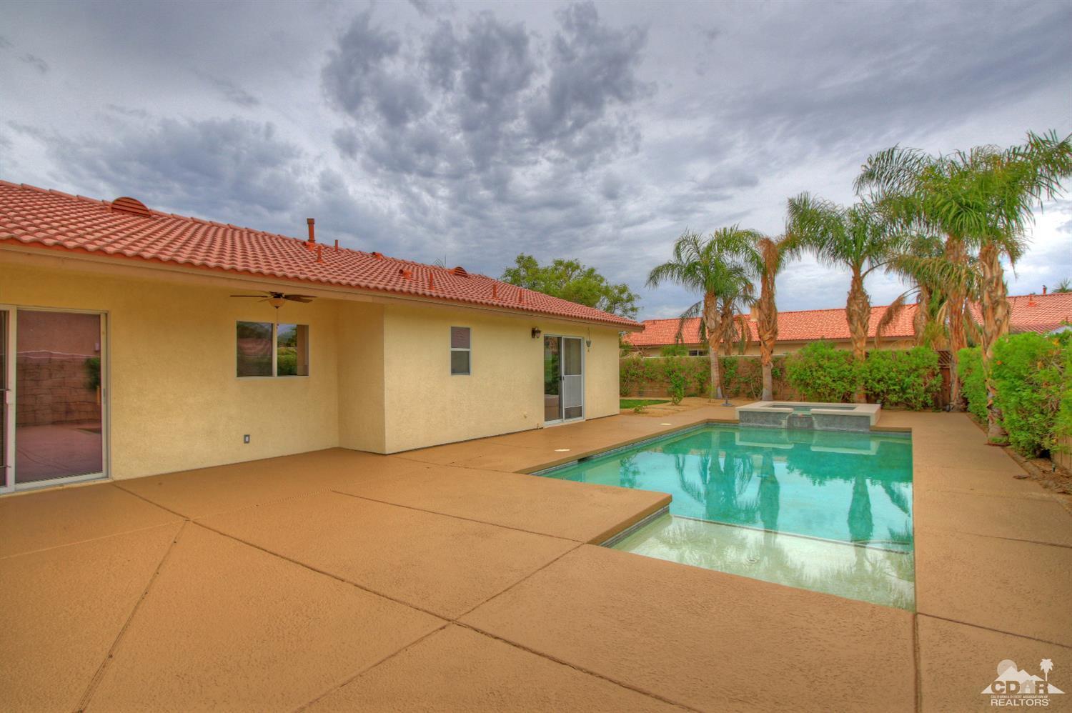 a view of a house with swimming pool