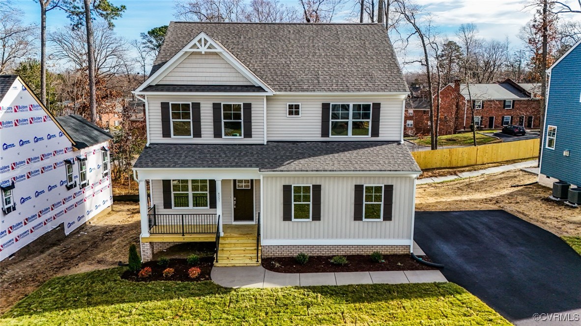 View of front of property featuring a porch and a