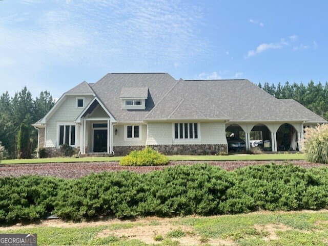 a front view of a house with a yard