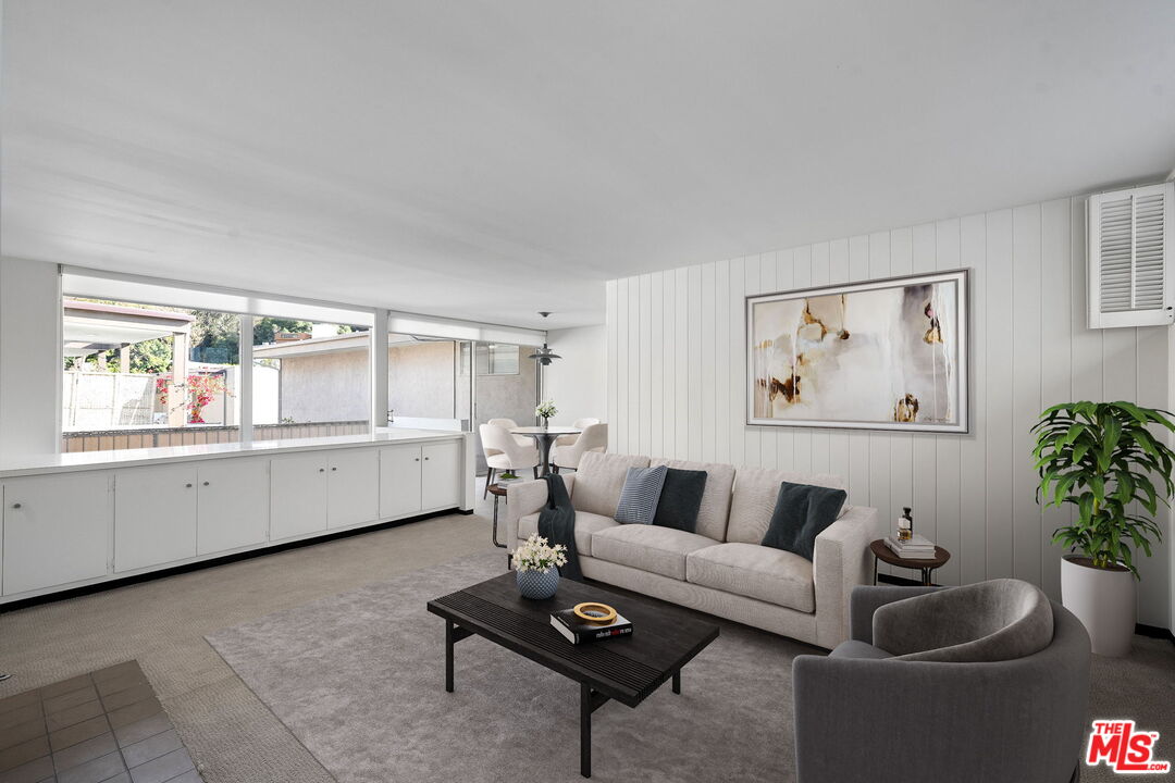 a living room with furniture and window