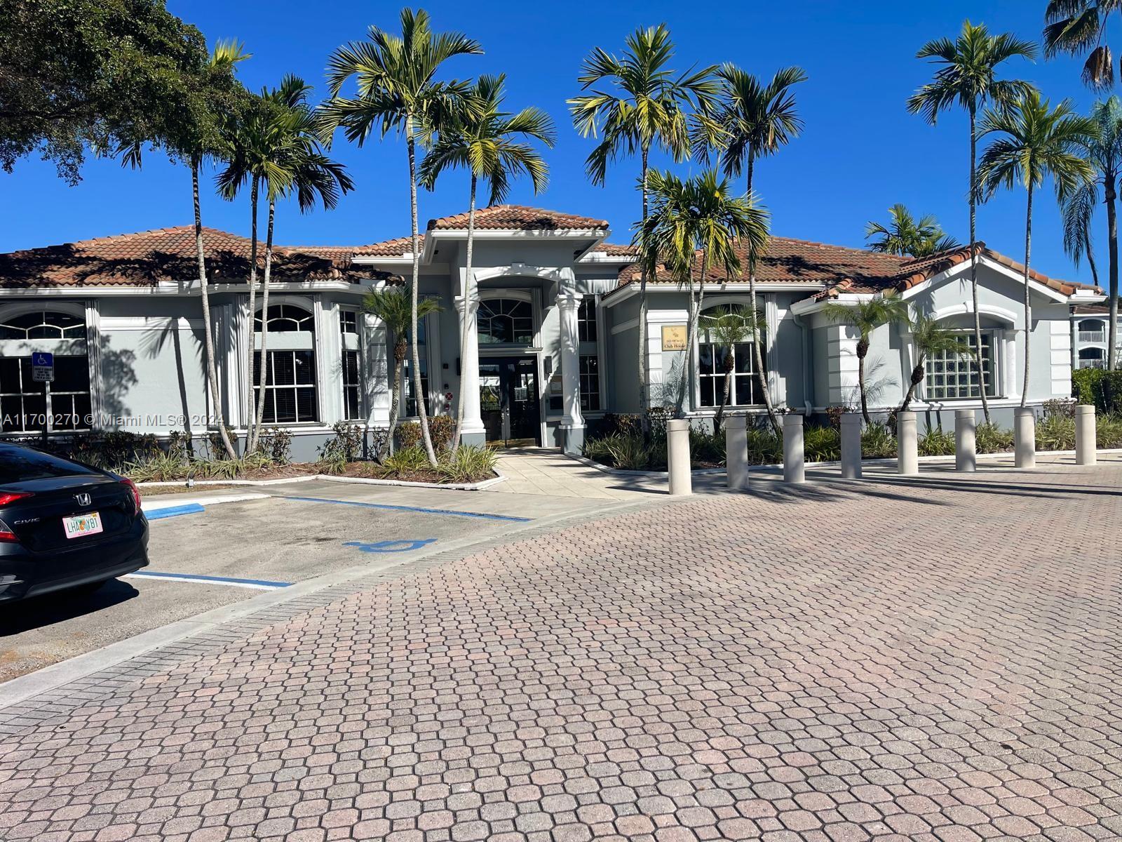 a view of a car park in front of a building