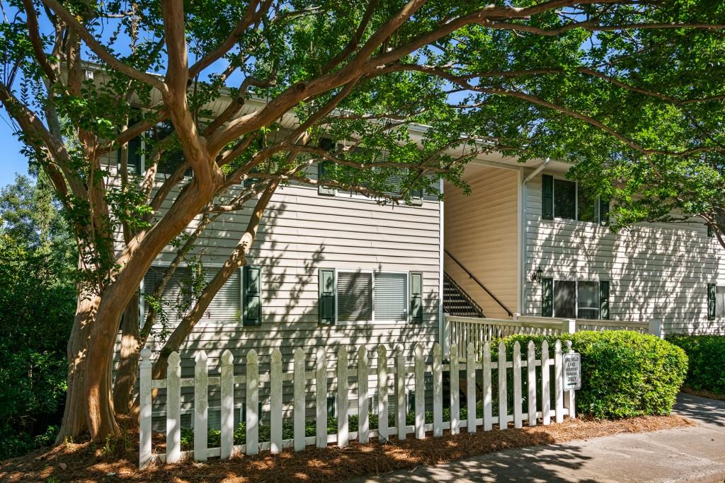 a view of a house with a tree