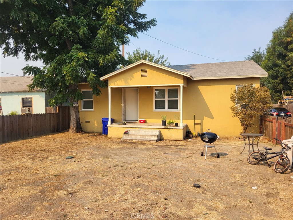 a view of a house with backyard space and balcony