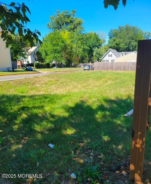 a view of a swimming pool with a yard