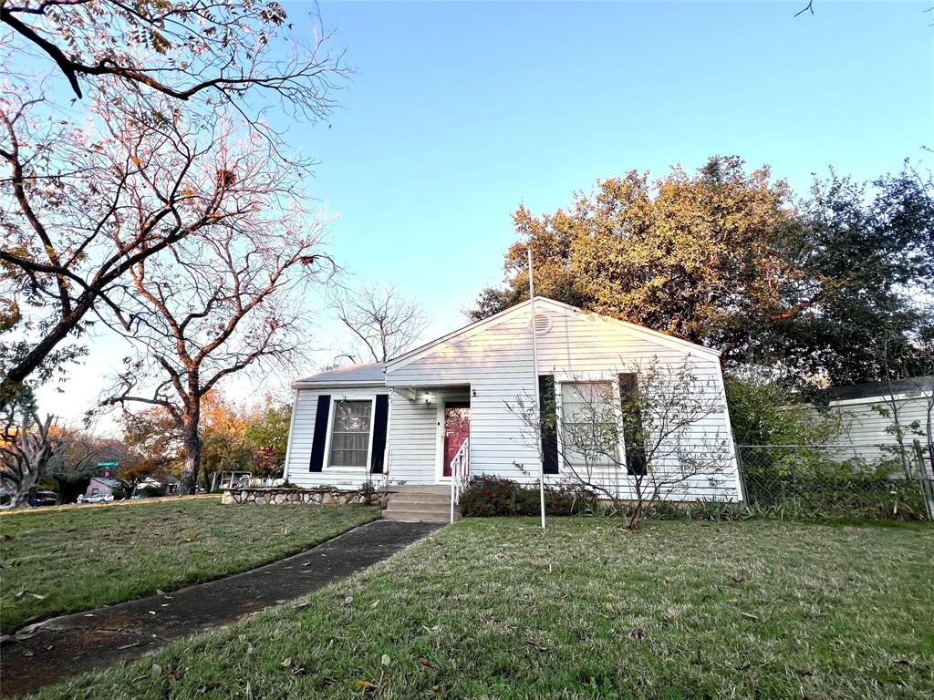 front view of a house with a yard