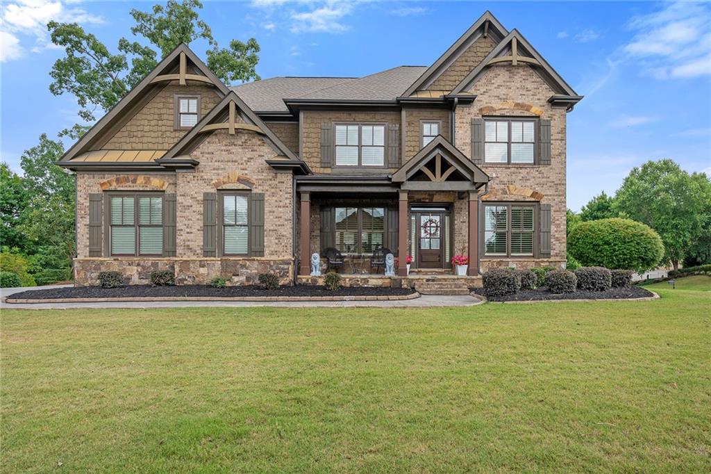 a front view of a house with a yard