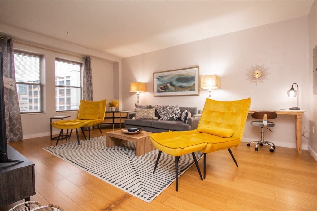 a living room with furniture and a table