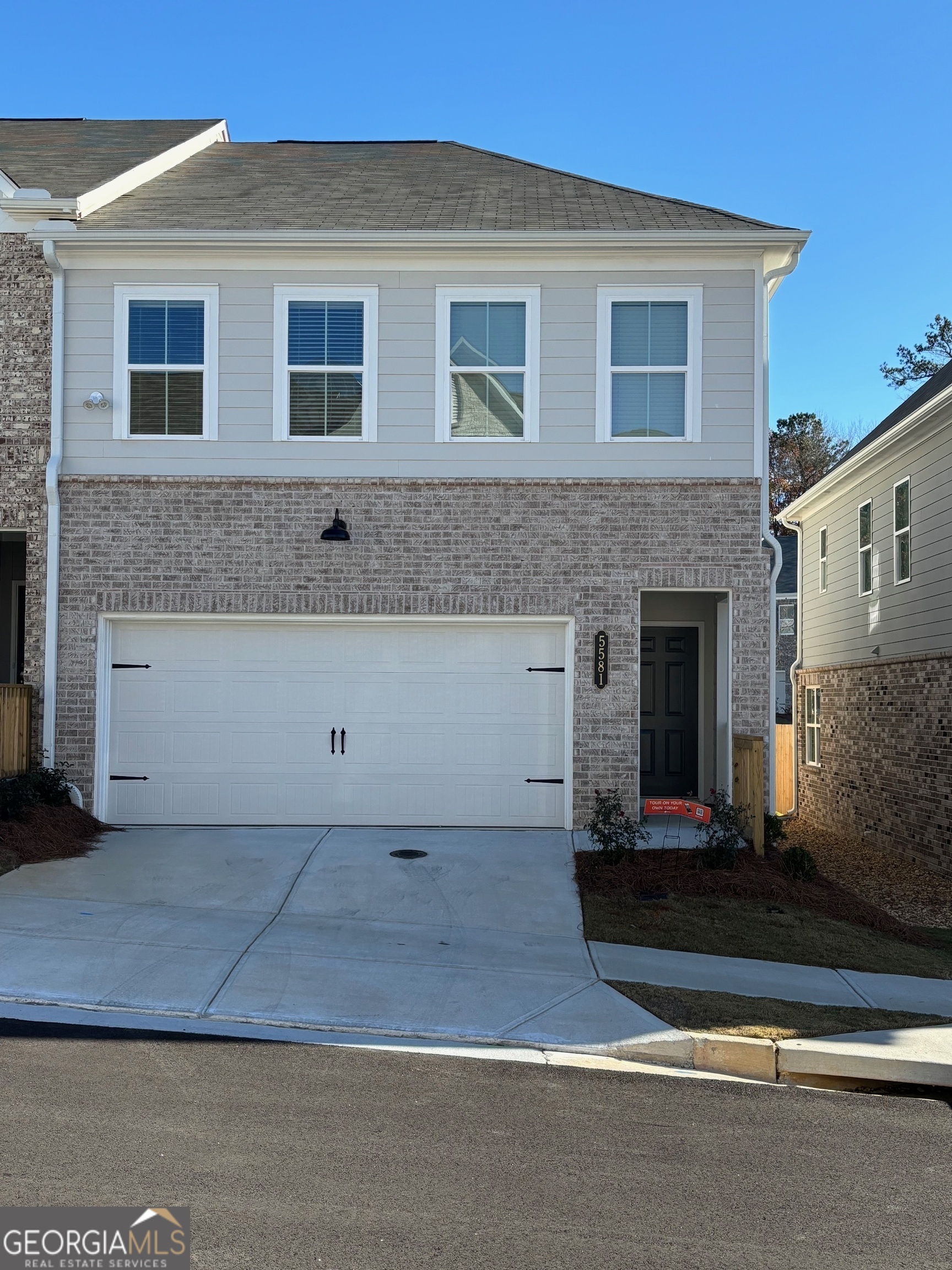 a front view of a house with yard