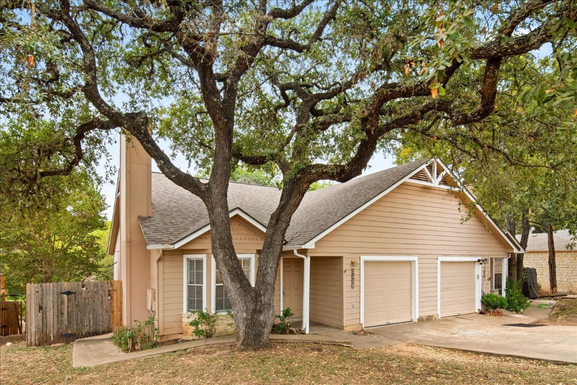 front view of a house with a trees