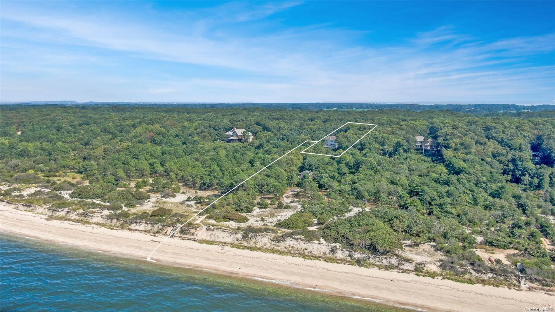 a view of a field with an ocean