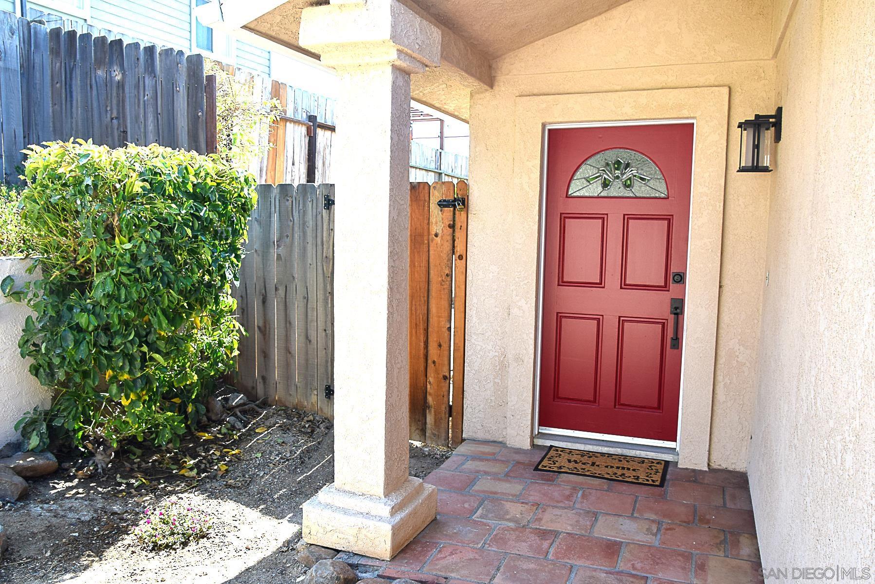 a view of front door with outdoor seating