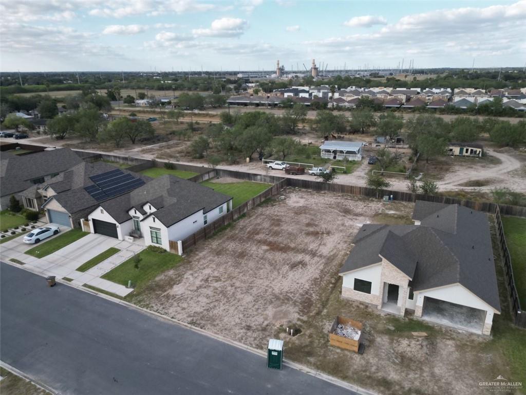 an aerial view of a house with a lake view