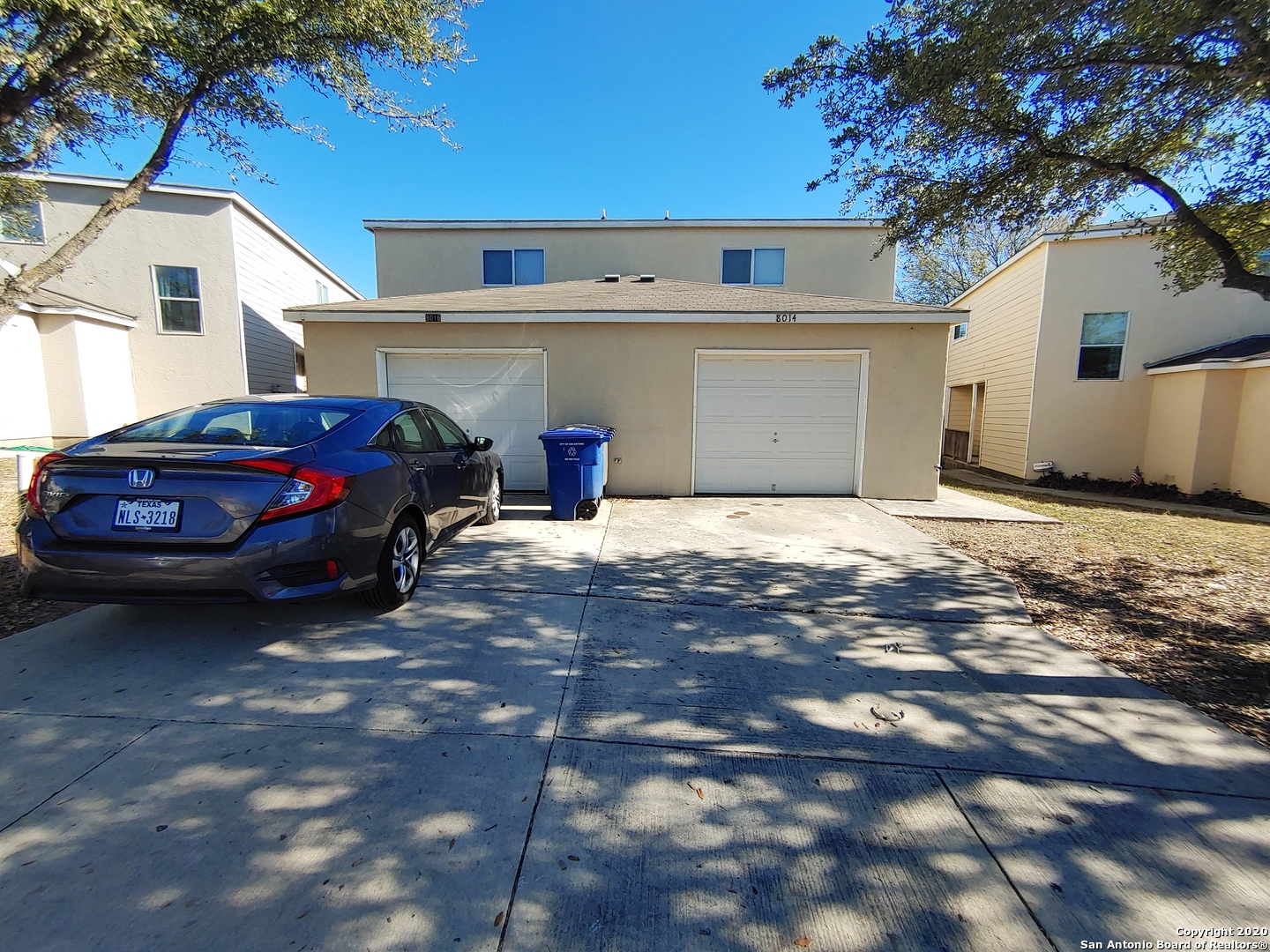 a view of a car in front of house