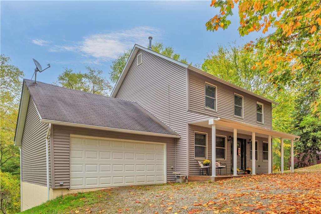 a view of a house with a garage