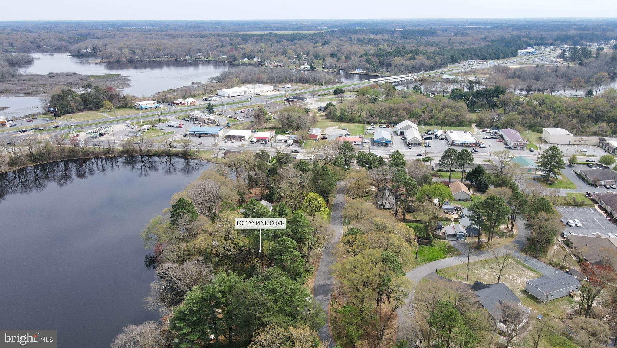 an aerial view of house with yard and lake view