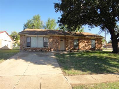 a front view of house with garden