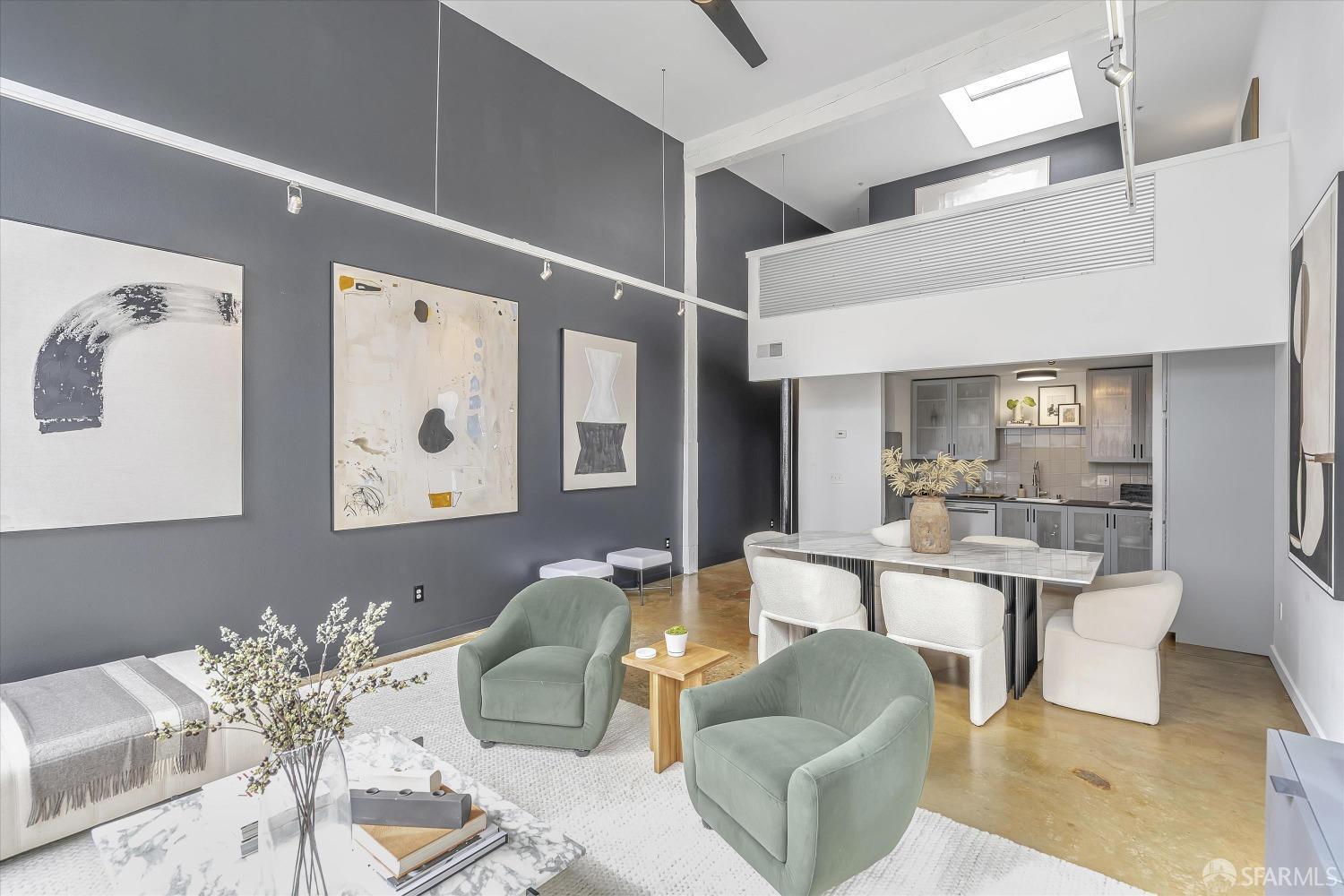 a living room with furniture and view of kitchen