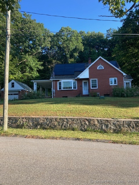 front view of a house with a big yard