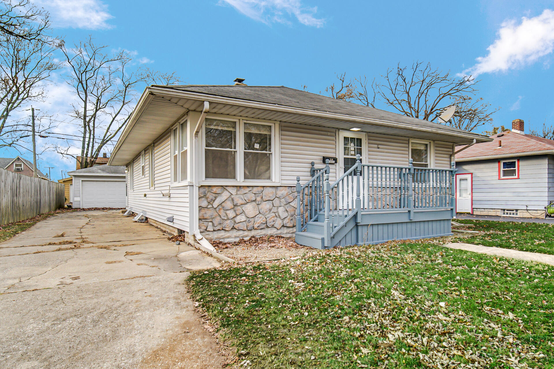 a view of a house with a bed and a yard