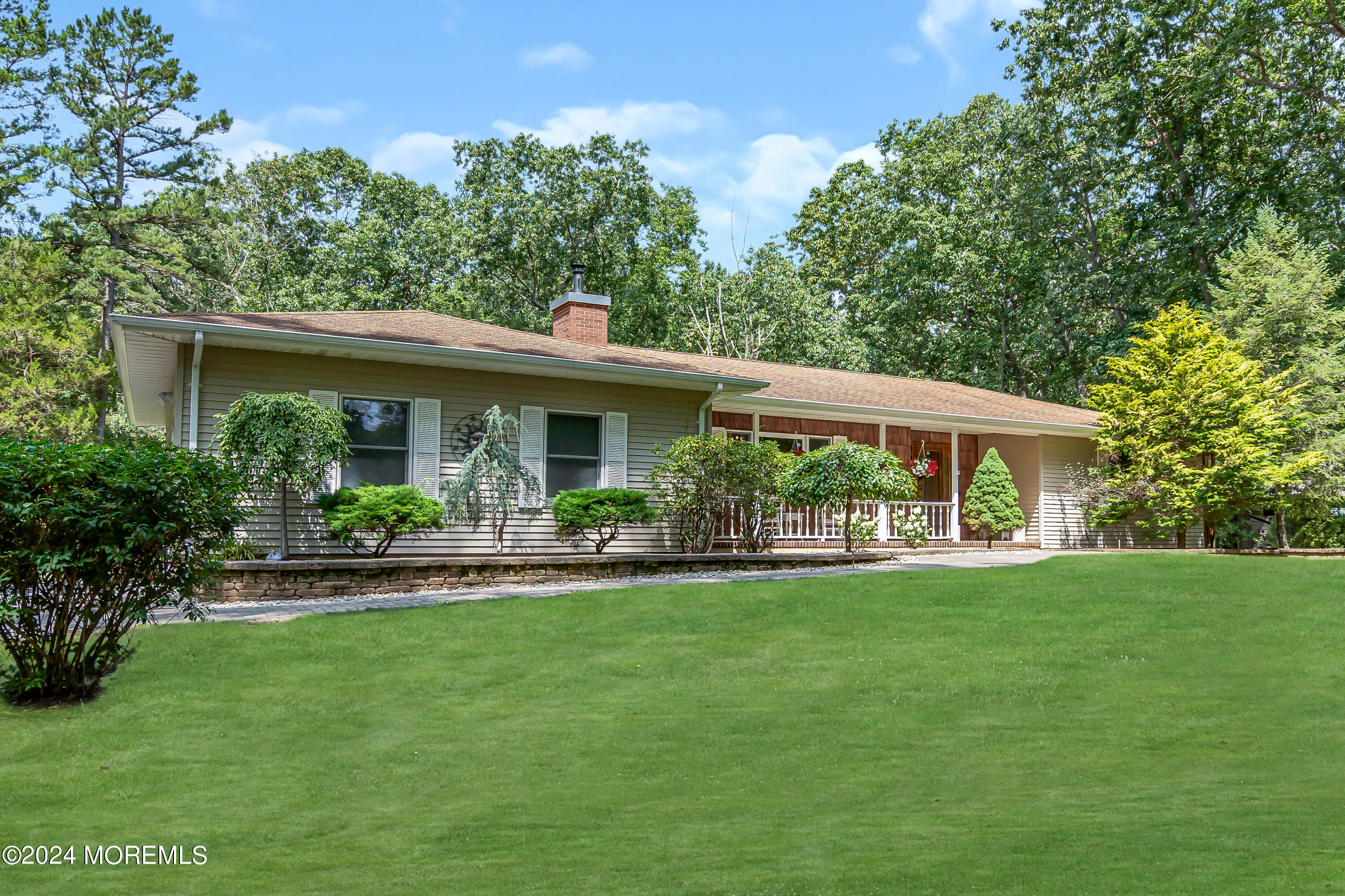 a front view of a house with a yard table and chairs