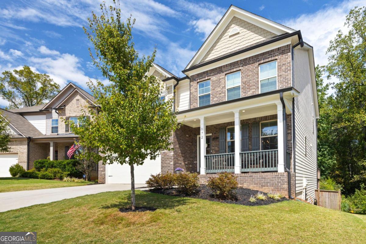 a front view of a house with a yard