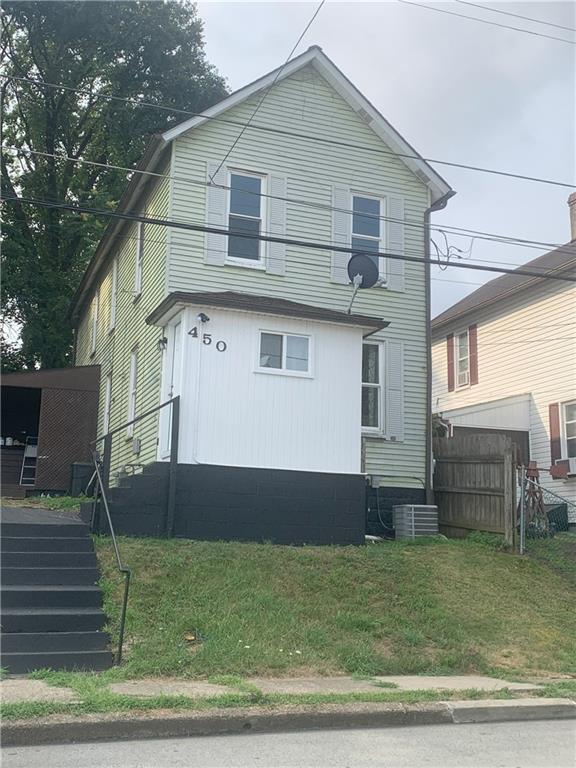 a front view of a house with a yard